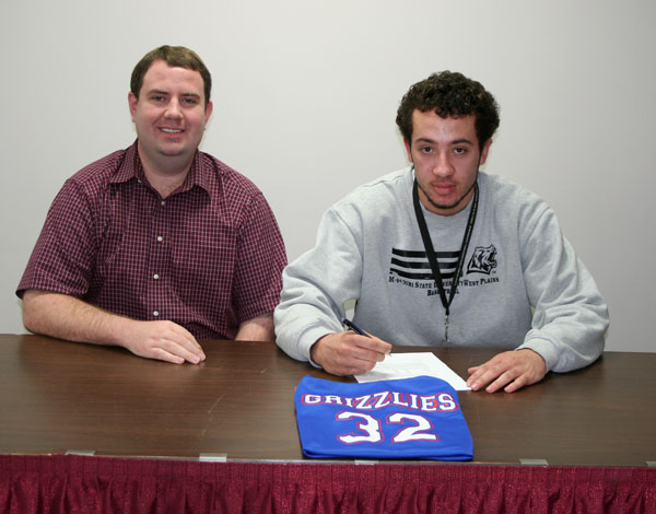 gage wooten signs web GAGE WOOTEN, right, a sophomore on the Missouri State University-West Plains Grizzly Basketball team, signed a national letter of intent Wednesday, April 11, to attend Minnesota State University in Mankato on a basketball scholarship beginning this fall. With him above is Grizzly Basketball Head Coach Yancey Walker. (Missouri State-West Plains Photo)