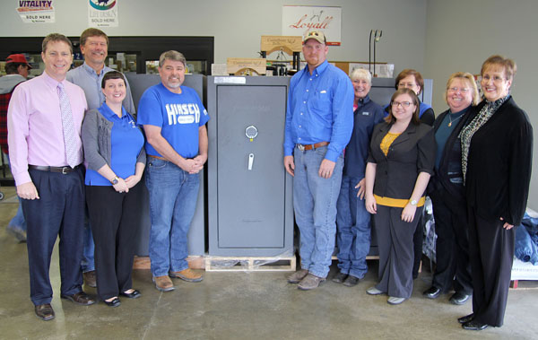 THIS FREEDOM SECURITY Independence Safe 22 gun safe donated by Hirsch Feed and Farm Supply in West Plains will be one of the items up for bid at Missouri State University-West Plains’ 19th Annual Auction Friday, April 5, at the West Plains Opera House. With the safe above are, from left, auction committee member Joe Kammerer, Hirsch parts manager Greg Brown, auction committee member Amanda Niemotka, Hirsch owner John Williams, livestock feed specialist Josh Kenyon and sales representative Sue Wheeler, and auction committee members Debbie Martin, Melissa Hinton, Barbara Nyden and Connie Pfeifer. (Missouri State-West Plains Photo)