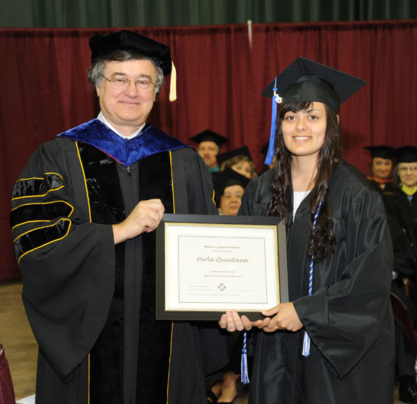 PERLA QUINTANA, Rogers, Ark., received the Missouri League of Nursing’s Outstanding Student Award for Associate of Science in Nursing degree graduates at Missouri State University-West Plains commencement ceremonies Saturday, May 18, at the West Plains Civic Center.  The award recognizes a graduate from the ASN program who exhibits exceptional leadership potential, interpersonal skills and continuing professional growth.  Quintana will receive a one-year membership to the MLN.  She received her award from Dean of Academic Affairs Dr. Christopher Dyer.  (Missouri State-West Plains Photo)