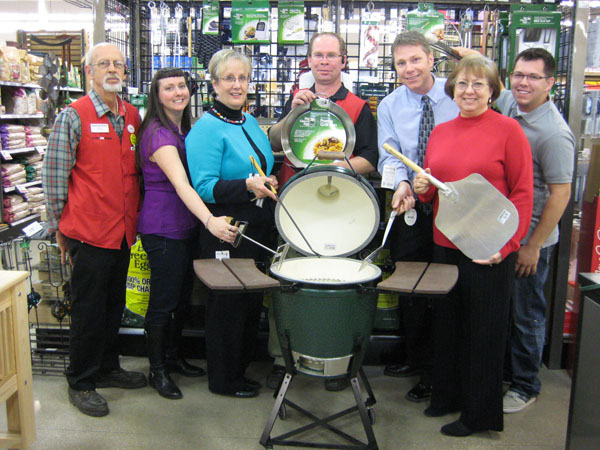 BETTER THAN AN EASTER EGG is this Big Green Egg charcoal grill donated by Westlake Ace Hardware 101, 1401 Mitchell Rd., to Missouri State University-West Plains’ annual auction, set for April 11 at the West Plains Opera House in downtown West Plains.  The grill is one of many items that will be up for bid in the event’s 20th year.  Proceeds will go toward two projects – the Tuttle Amphitheater and upgrades to the Garnett Library.  Reserved tables of eight are on sale now for $350.  Open theater-style seating also is available for $35 per person.  Visit http://wp.missouristate.edu/development/auction.htm or call the development office at 417-255-7240 for more information or to purchase tickets.  With the grill above are Westlake representative Wayne Gore, Development Events Coordinator Amanda Niemotka, auction committee member Connie Pfeifer, Westlake representative Kelly Sapanas, Director of Development Joe Kammerer, Administrative Assistant Debbie Martin and Taler Sutherland, a student at the university and auction committee member.  (Missouri State-West Plains Photo)