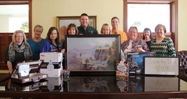 MANY ITEMS already have been donated for Missouri State University-West Plains’ 20th annual auction set for 6 p.m. April 11 at the West Plains Opera House on Court Square in downtown West Plains.  With some of the items above are auction committee members Melody Hubbell, Connie Pfeifer, Aimee Staggenborg, Cindy McFarland, Marc Hubbell, Debra Mosley, Joe Kammerer, Barbara Nyden, Amanda Niemotka and Debbie Martin.  (Missouri State-West Plains Photo)