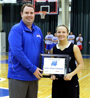     ALICIA BLAND, Bunker, won the girls 3-point shooting competition at the annual Grizzly All-Star Classic Saturday, April 19, at the West Plains Civic Center.  She receives her award from Missouri State University-West Plains Head Coach Yancey Walker.  (Photo provided)