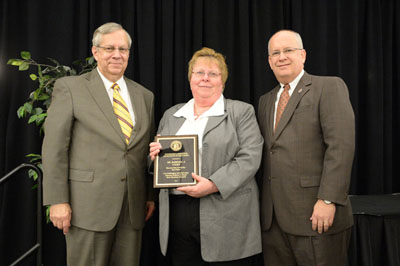 BARBARA NYDEN, center, associate professor of accounting/entrepreneurship at Missouri State University-West Plains, received the Governor’s Award for Excellence in Education during an April 2 luncheon in Columbia, Mo.  With her are Missouri Commissioner of Higher Education David R. Russell, left, and Missouri State University System President Clif Smart.  (Photo provided)