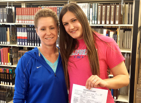 GRIZZLY VOLLEYBALL STANDOUT Helena Peric, right, celebrates her decision to attend the University of California-Riverside beginning next fall with Grizzly Volleyball Head Coach Paula Wiedemann.  (Photo provided)