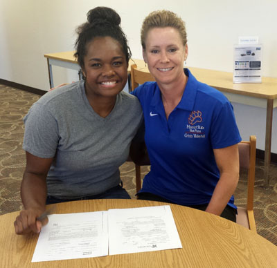 GRIZZLY VOLLEYBALL STANDOUT Torika Baleilekutu, left, celebrates her decision to attend the University of Memphis in Memphis, Tenn., beginning next fall with Grizzly Volleyball Head Coach Paula Wiedemann.  (Photo provided)