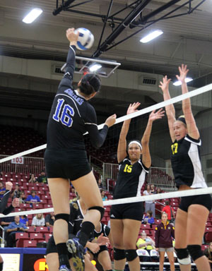 PENNY LIU (NO. 16), a freshman outside attacker for the Grizzlies, appears to strike fear in the eyes of these two Indian Hills players during Wednesday night’s home opening match at the West Plains Civic Center.  Despite Liu’s 18 kills, Indian Hills won the contest.  (Missouri State-West Plains Photo)