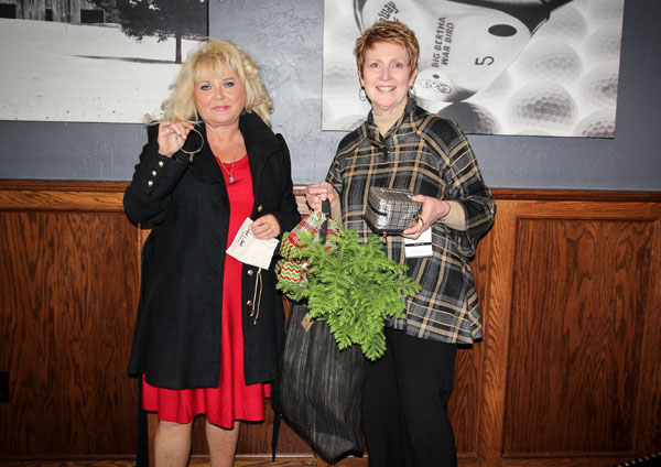 PRIZE WINNERS at the Nov. 7 “Celebrate in Style” fashion show fundraiser benefitting the Friends of the Garnett Library included, left, Connie Yates, Pottersville, who received a Brighton bangle bracelet provided by The Kloz Klozet, and Kathy Grigsby, West Plains, who received a travel jewelry case provided by The Kloz Klozet and a royal standard handbag and palm plant provided by Cottage Flowers and Interiors.  Florence James, owner of The Kloz Klozet, and Kristi Bash, owner of Cottage Flowers and Interiors, hosted the event.  (Missouri State-West Plains Photo)