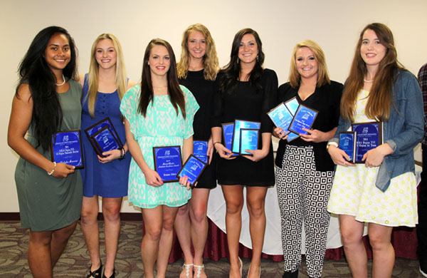 SEVEN MEMBERS of the 2014 Grizzly Volleyball team at Missouri State University-West Plains received individual awards during the annual Grizzly Sports Banquet/Hall of Fame Induction Ceremony Tuesday evening, April 7, at the West Plains Civic Center’s Magnolia Room.  Sophomore libero Alyssa Aldag, Fort Worth, Texas, received first team All-Region 16 honors and the Best Defensive Player (811 digs/5.27 digs per game) and Service Reception (2.57 passing rating/854 attempts) Awards.  Freshman right side/middle attacker Ashley Bishton, Liberty, received the Blocking Award (122 total blocks/.79 blocks per game, 25 solo blocks).  Freshman setter Susannah Kelley, Jonesboro, Ark., received first-team All-Region 16 honors, the Setter/Most Assists Award (1,159 assists/7.53 assists per game) and the Grizzly Award for making a difference in team culture.  Freshman outside attacker Gabby Edmondson, Christchurch, New Zealand, received the first-team All-Region 16 Team and Newcomer Awards.  Sophomore outside hitter/defensive specialist Kaili Simmons, El Dorado Springs, and sophomore setter Brianna Zebert, Pierce City, both received the Grizzly Leadership/Captains Award and the Marvin Wheeler Academic Excellence Award.  Simmons and freshman outside attacker Pulotu Manoa, Concord, Calif., received the honorable mention All-Region 16 Award.  In addition, freshman middle attacker Penny Liu, Nanjing, China, who has already transferred to Columbia College in Columbia, received the first-team All-Region 16 Award, first-team All-American Awards from the National Junior College Athletic Association and the American Volleyball Coaches Association and the Best Offensive Player Award (586 kills/3.18 kills per game, 1,048 attempts, .453 attacking percentage).  From left are Manoa, Kelley, Zebert, Bishton, Simmons, Aldag and Edmondson.  (Missouri State-West Plains Photo)