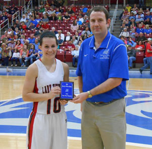 CASSIDY JOHNSON, West Plains, won the girls 3-point shooting competition at the annual Grizzly All-Star Classic Saturday, April 4, at the West Plains Civic Center. She receives her award from Missouri State University-West Plains Head Coach Yancey Walker. (Photo provided)