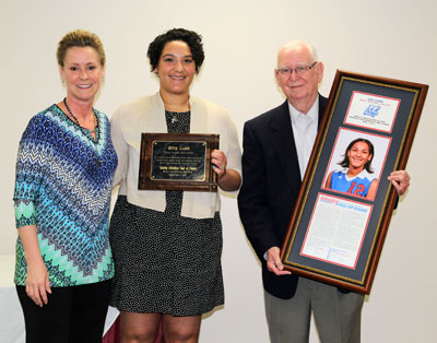 FORMER GRIZZLY Volleyball standout Amy Lusk Sheble, center, was inducted into the Grizzly Hall of Fame by Missouri State University-West Plains and Grizzly Booster Club officials during the annual Grizzly Sports Banquet/Hall of Fame Induction Ceremony Tuesday evening, April 7, at the West Plains Civic Center’s Magnolia Room.  She received her award from Grizzly Volleyball Head Coach Paula Wiedemann and Grizzly Hall of Fame Selection Committee Chairman Ron Shemwell.  (Missouri State-West Plains Photo)