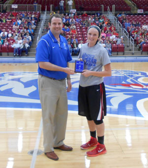 HANNAH MASTERS, Dora, was named the most valuable player in the girls game of the annual Grizzly All-Star Classic Saturday, April 4, at the West Plains Civic Center arena.  She scored 15 points to help lead her team to a 78-72 win.  Above, she receives her award from Missouri State University-West Plains Grizzly Basketball Head Coach Yancey Walker.  (Photo provided)