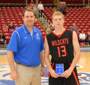 LANE DUNCAN, right, Licking, was named the most valuable player in the boys game of the annual Grizzly All-Star Classic Saturday, April 4, at the West Plains Civic Center arena.  He scored 24 points and grabbed 12 rebounds to help lead his team to a 111-72 win.  Duncan receives his award from Missouri State University-West Plains Grizzly Basketball Head Coach Yancey Walker.  (Photo provided)