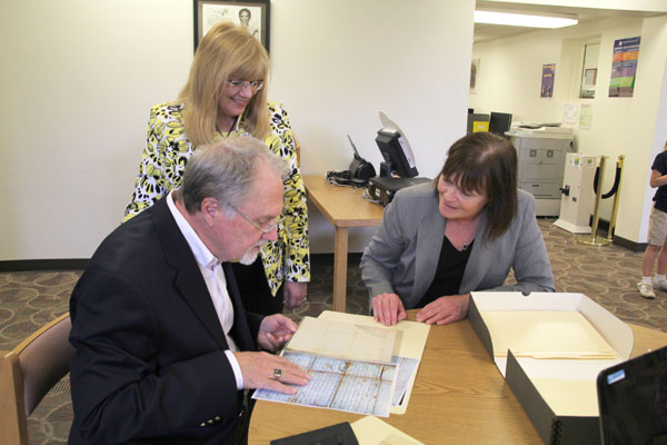 WEST PLAINS RESIDENT CHUCK KIMBERLIN discusses one of 52 Civil War-era letters he recently donated to Missouri State University-West Plains with Director of Library Services Sylvia Kuhlmeier, standing, and Assistant Professor of History Connie Morgan.  The letters, written by Sgt. John Arnold of the 97th New York Regiment, give a unique, first-person account of the conflict.  (Missouri State-West Plains Photo)