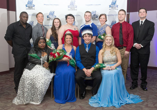 MEMBERS OF THE 2016 Missouri State University-West Plains Homecoming Court gather around this year’s king and queen in the lobby of the West Plains Civic Center for photos following the crowning, which took place at halftime of the Jan. 16 basketball game between the Grizzlies and Three Rivers College Raiders of Poplar Bluff.  Seated from left are 2016 Homecoming Queen candidate Jayla Ray, Florissant; Queen Katelyn Grogan, Cabool; King Casey Buehler, West Plains; and Queen candidate Kendra Barnard, St. Charles. Back row: 2016 Homecoming King Candidates Kwamain Hall, Waynesville and Zach Kaufman, Dora; Queen candidate Sydney McBride, Lebanon; 2015 Homecoming Queen and King Emily Yeager, Dora, and Lance Parker, Dixon; 2016 Queen candidate Lindsay Randolph, West Plains; and King candidates William Hatcher and William Osborn, both of West Plains.  (Missouri State-West Plains Photo).