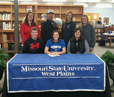 KINLI SIMMONS, a 5-foot, 8-inch setter from El Dorado Springs, recently signed paperwork indicating her intention to attend Missouri State University-West Plains on a volleyball scholarship beginning next fall. Simmons, who helped lead her team to four consecutive district titles and two Class 2 state quarterfinal appearances, is the sister of former Grizzly Kaili Simmons (2013-14). On hand for the signing were, seated from left, brother Kaiden Simmons, Kinli Simmons, and mother Sherri Simmons; standing: El Dorado Springs High School Head Volleyball Coach Ashley Rogers, father Ronnie Simmons, Missouri State-West Plains Assistant Volleyball Coach Briana Walsh and El Dorado Springs Assistant Volleyball Coach Stephanie Allen. (Photo provided)