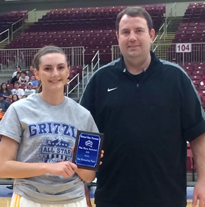 ALI SPARKS, Fordland, was named the most valuable player in the girls game of the annual Grizzly All-Star Classic Saturday, March 26, at the West Plains Civic Center arena.  She scored 19 points to help lead her team to a 79-75 win.  She also was the girls' 3-point shooting contest winner. Above, she receives her MVP award from Missouri State University-West Plains Grizzly Basketball Head Coach Yancey Walker.  (Photo provided)