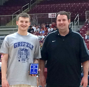 RYAN WARD, left, Hartville, won the boys 3-point shooting competition at the annual Grizzly All-Star Classic Saturday, March 26, at the West Plains Civic Center.  He receives his award from Missouri State University-West Plains Head Coach Yancey Walker.  (Photo provided)