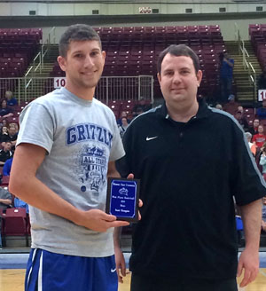 WYATT SUMMERS, left, Bakersfield, won the slam dunk contest at the annual Grizzly All-Star Classic Saturday, March 26, at the West Plains Civic Center.  He receives his award from Missouri State University-West Plains Head Coach Yancey Walker.  (Photo provided)