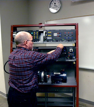 JIM HART, assistant professor of computer information systems at Missouri State-West Plains, inspects equipment that will be used to train students at the new Greater Ozarks Center for Advanced Technology (GOCAT) in West Plains. GOCAT is a partnership between Missouri State University-West Plains, the South Central Career Center and the City of West Plains. (Photo provided)