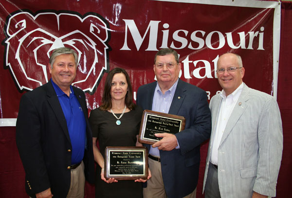 PLAQUES WERE PRESENTED to this year’s Distinguished Alumni Award recipient Dr. Judene Blackburn, former superintendent of the Waynesville R-6 School District, and Distinguished Faculty/Staff Award recipient Dr. Herb Lunday, former dean of student services, during the annual Missouri State University Alumni Association’s spring picnic for alumni and friends Thursday, May 5, at the West Plains Civic Center exhibit hall. Approximately 180 attended the event, which gives area alumni and friends an opportunity to hear about the latest activities, events and accomplishments of the university. The Distinguished Alumni Award recognizes a Missouri State University alumnus who has made extraordinary achievements in his or her personal and professional endeavors and has shown notable success in his or her profession or business, loyalty to the university and outstanding contributions to society. The Distinguished Faculty/Staff Award recognizes extraordinary service among former employees of Missouri State-West Plains. From left above are Missouri State University-West Plains Chancellor Drew Bennett, Blackburn, Lunday and Missouri State University System President Clif Smart.  (Missouri State-West Plains Photo)