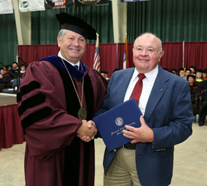 WEST PLAINS RESIDENT LAUREL THOMPSON, right, received an honorary Associate of Science degree Saturday, May 14, during Missouri State University-West Plains’ commencement ceremony at the West Plains Civic Center arena. He received his degree from Missouri State-West Plains Chancellor Drew Bennett.  (Missouri State-West Plains)