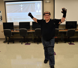REACHING OUT – Missouri State University-West Plains student Michael Scheidt, West Plains, demonstrates the Perception Neuron Motion Capture System, a recent acquisition of the university’s Computer Graphics and Programming Department. (Photo provided)