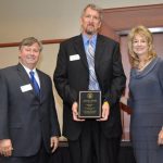 JEFFREY C. HUFF, center, associate professor of computer graphics and programming at Missouri State University-West Plains, received the Governor’s Award for Excellence in Education during an April 4 luncheon in Columbia, Mo. With him are Missouri State-West Plains Chancellor Drew Bennett, left, and Kathryn Swan, Cape Girardeau, chairwoman of the Missouri Coordinating Board for Higher Education (CBHE). (Photo provided)