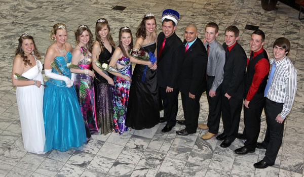 MEMBERS OF THE 2013 Missouri State University-West Plains Homecoming Court gather around this year’s king and queen in the lobby of the West Plains Civic Center for photos following the crowning, which took place at halftime of the Feb. 19 basketball game between the Grizzlies and Three Rivers College Raiders of Poplar Bluff, Mo. From left are 2013 Homecoming Queen candidates Abby Luallin of Conway, Hope Harris of West Plains, Anna Cantrell of Conway and Nikki Rieken of Ava; 2012 Grizzly Homecoming Queen Kristi Ary, West Plains, who crowned the 2013 queen; 2013 Homecoming Queen Krista Poole, Jefferson City; 2013 Homecoming King Taler Sutherland, West Plains; 2012 Homecoming King Tony Ary, West Plains, who crowned the 2012 king; and 2013 Homecoming King candidates T.J. Wallis of New Bloomfield, John Beam of West Plains, Cody Skidmore of Conway, and Dalton Stockton of West Plains. (Missouri State-West Plains Photo).