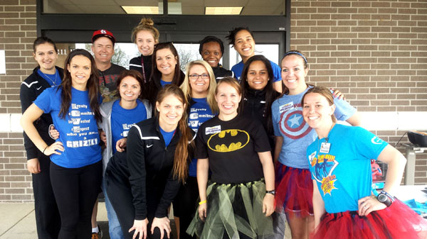 MEMBERS OF THE GRIZZLY Volleyball team at Missouri State University-West Plains served as volunteers during the April 26 Ozarks Medical Center (OMC) Fun Run in West Plains. The student athletes helped with registration, handed out and gathered timing sensors, worked water stations, conducted manual timing of participants, and helped elsewhere when needed. Above are, front row from left, Grizzly Adrijana Mazulovic, OMC Cancer Center Radiation Therapist Christy Chambers and OMC Media Relations Specialist Shandi Brinkman. Second row: Grizzlies Brianna Zebert, Paris Witte, Kaili Simmons, Alyssa Aldag and Laiz Novaes, and OMC Wellness Coordinator Stephanie James. Back row: Grizzly Helena Peric, OMC Foundation Executive Director Ward Franz, and Grizzlies Ashley Bishton, Lee Lee Barrett and Nella Ioramo. (Photo provided)