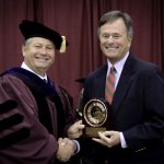 LONG-TIME UNIVERSITY SUPPORTER David Gohn, right, West Plains, received the prestigious Granvil Vaughan Founder’s Award during Saturday’s Missouri State-West Plains commencement ceremonies at the West Plains Civic Center. Above, Gohn receives the award from Missouri State-West Plains Chancellor Drew Bennett. (Missouri State-West Plains Photo)