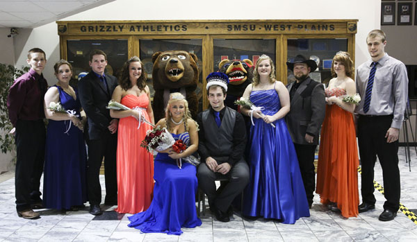 MEMBERS OF THE 2014 Missouri State University-West Plains Homecoming Court gather around this year’s king and queen in the lobby of the West Plains Civic Center for photos following the crowning, which took place at halftime of the Jan. 18 basketball game between the Grizzlies and Three Rivers College Raiders of Poplar Bluff, Mo. Seated are 2014 Grizzly Homecoming Queen Brady Peterson, West Plains, and King Zach Collins, Willow Springs. Standing from left are 2014 Homecoming King and Queen candidates T. J. Wallis, New Bloomfield; Anyta Cavitt, West Plains; John Beam, West Plains; and Sarah Agee, Conway; Grizz (Sam Dodson, West Plains); Ms. Grizz (Allison Sweatt, Camdenton); and candidates Ashley Howell, West Plains; Bruce Cavitt, West Plains; Amanda Justus, Vienna; and Aaron Orchard, Rogersville. (Missouri State-West Plains Photo).