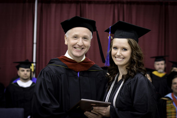 CASEY HALL, Pomona, received the Outstanding Student Award for Associate of Science in Nursing degree graduates at Missouri State University-West Plains’ commencement ceremonies Saturday, May 17, at the West Plains Civic Center. The award recognizes a graduate from ASN program who exhibits academic achievement and honesty, class participation, conscientiousness, university and community service, and outstanding clinical performance. Hall graduated with both the ASN and Associate of Arts in General Studies degrees at Saturday’s commencement. She received her award from Interim Dean of Academic Affairs Dennis Lancaster. (Missouri State-West Plains Photo)
