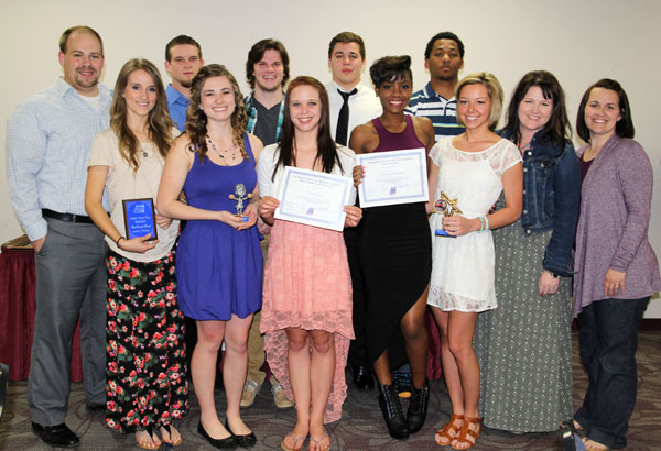 SEVERAL MEMBERS of the 2014-2015 Grizzly Cheer Team at Missouri State University-West Plains received individual awards at the annual Grizzly Sports Banquet/Hall of Fame Induction Ceremony Tuesday evening, April 7, at the West Plains Civic Center’s Magnolia Room. Front row from left, Ashley Rieken, Ava, Best Overall Cheerleader-Female; Micaela Wiehe, West Plains, Coaches’ Award for Excellence; Ciera Carey, West Plains, Most Improved Cheerleader-Female; Essence Vertreese, Kansas City, Mo., Best Flyer; Katie Land, West Plains, Outstanding Leadership-Female; Cheer Team Coordinator Rachel Peterson; Head Coach Keena Simpson. Back row: Assistant Coach Nick Pruitt; Trey Turner, West Plains, Best Overall Cheerleader-Male; Lance Parker, Dixon, Outstanding Leadership-Male; Jacob Rudolph, Mtn. View, Best Base; Chris Rodgers-Smith, St. Louis, Most Improved Cheerleader-Male. (Missouri State-West Plains Photo)