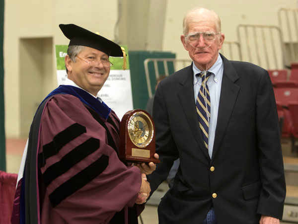 LONG-TIME UNIVERSITY SUPPORTER Roger D. “Dusty Shaw, right, Thomasville, received the prestigious Granvil Vaughan Founder’s Award during Saturday’s Missouri State-West Plains commencement ceremonies at the West Plains Civic Center. Above, Shaw receives the award from Missouri State-West Plains Chancellor Drew Bennett. (Missouri State-West Plains Photo)