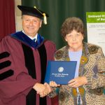WEST PLAINS RESIDENT LINDA MOORE received an honorary Associate of Applied Science degree Saturday, May 16, during Missouri State University-West Plains’ commencement ceremony at the West Plains Civic Center arena. She received her degree from Missouri State-West Plains Chancellor Drew Bennett. (Missouri State-West Plains)