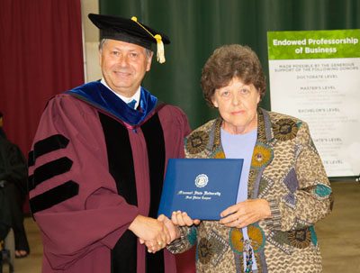LINDA MOORE, right, West Plains, received an honorary Associate of Applied Science degree at Missouri State University-West Plains' 2015 commencement ceremony. Chancellor Drew Bennett presented her with the degree. (Missouri State-West Plains Photo)
