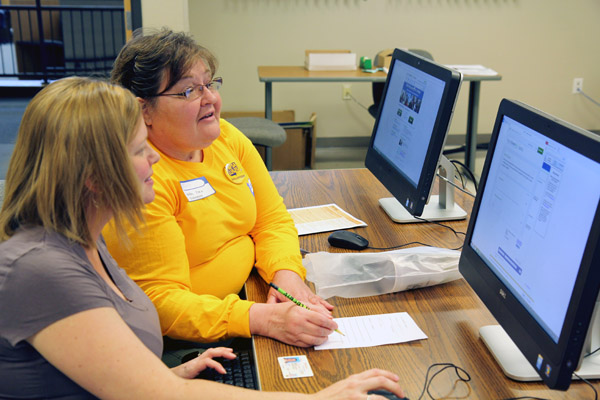 BETHANY ROBERTS, left, West Plains, was one of 20 area residents, including students, parents or spouses, who received free help filling out their Free Application for Federal Student Aid (FAFSA) during Missouri State University-West Plains’ FAFSA Frenzy event Saturday, March 5, at the Lybyer Technology Center. This is the seventh year Missouri State-West Plains has hosted the event, a program of College Goal Sunday, which gives students and their parents free access to financial aid professionals who can guide them through the application process. Donna Bassham, coordinator of financial aid at the university, said help was given to anyone planning to attend college, not just those who are current students or are planning to attend Missouri State-West Plains next fall. Ten volunteers, including, with Roberts above, Mary Kellum, coordinator of the university’s TRiO Student Support Services program, assisted students with their forms. Bassham said university officials are looking forward to hosting the event again next year. (Missouri State-West Plains Photo)
