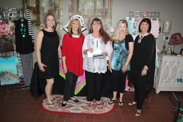 THREE WEST PLAINS RESIDENTS won giveaways at the “Black and White (With a Pop of Color)” fashion show Friday, April 22, at the West Plains Country Club. Caitlin Jacques won a Brighton magnifying necklace from The Kloz Klozet, Maureen Nickey won a Mudpie sun hat from Cleea’s At Home Market, and Sandy Reed won Brighton sunglasses from The Kloz Klozet and a $50 gift certificate from Cleea’s At Home Market. The annual event, hosted by The Kloz Klozet and Cleea’s At Home Market and sponsored by Friends of the Garnett Library, raises funds to support library needs. From left are Paige Ferguson of Cleea’s At Home Market; Nickey; Reed; Jacques; and Florence James, owner of The Kloz Klozet. (Missouri State-West Plains photo)