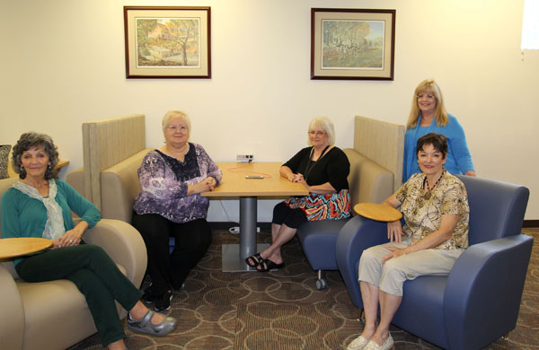 MEMBERS OF THE FRIENDS of the Garnett Library Executive Committee sit in comfortable, tech-friendly furnishings recently purchased with funds raised by the organization for the Garnett Library, located on the campus of Missouri State University-West Plains. Students can now enjoy two booth seating arrangements with easy access to USB and electrical outlets, as well as four lounge chairs with tablet arms. From left are Friends President Ruth Hall, Publicity/Membership Co-Chair Susie Warden, Publicity Co-Chair Sally Watkins, Director of Library Services Sylvia Kuhlmeier, and Friends Secretary Kathy Schloss. Other Friends officers for the 2016-17 academic year include Vice President Kay Garrett, Gifts and Bequests Chair Joe Kammerer, Membership Chair Carol Silvey, Program Chair Dr. Phillip Howerton and Projects/Fundraising Chair Miriam Ward. (Missouri State-West Plains Photo)