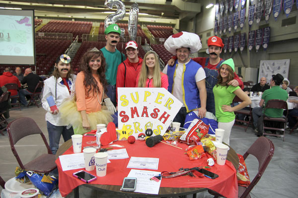 “SUPER SMASH BROS” was the theme of this table by the Grizzly Cheer Team that placed second in the table-decorating contest of the 13th annual Trivia Night to benefit Grizzly Athletics at Missouri State University-West Plains. Team members included, from left, Brittany Farias, Bobbi Taylor, Colt Tompkins, Lance Parker, Mackenzie Lamb, Nick Pruitt, Mike Driscoll and Miranda Donnelly. (Missouri State-West Plains Photo)