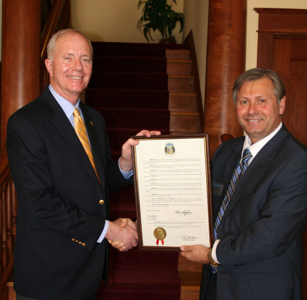 33RD DIST. STATE SEN. MIKE CUNNINGHAM (R-Rogersville), left, presents a framed resolution from the Missouri Senate honoring Missouri State University-West Plains on its 50th anniversary year to Chancellor Drew Bennett. Noting many of the campus’ accomplishments, the resolution stated senators “applaud the history, goals and accomplishments associated with Missouri State University-West Plains” and convey “this legislative body’s most heartfelt best wishes for a highly successful Golden Anniversary celebration.” The resolution was adopted by the senate on Feb. 13, 2013, two days before university officials kicked off their year-long celebration with a reunion and concert at the West Plains Civic Center. For more information about anniversary activities and events, visit the anniversary website, 50th.wp.missouristate.edu. (Missouri State-West Plains Photos)
