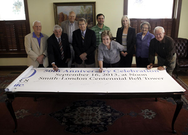 MEMBERS OF THE 50TH ANNIVERSARY Honorary Steering Committee at Missouri State University-West Plains put their final “seal of approval” on plans for the university’s Sept. 16 50th Anniversary Celebration by signing this banner, which will be placed inside a time capsule at the event. The celebration will begin at noon at the Smith-London Centennial Bell Tower on Franklin Street just west of the Lybyer Technology Center, and everyone attending will be asked to sign the banner before it is sealed in the capsule. The free celebration will include a short ceremony, picnic lunch, historic photo, and cake, organizers said. Free T-shirts will be handed out to the first 400 people who arrive, and several prizes, including an iPad, will be given away. Signing the banner above are committee members, front row from left, Marvin Fowler, Marvin Looney, Marvin Green, Karyn Vaughan and Bob Manning; back row: West Plains Mayor Jack Pahlmann, David M. Gohn, Mary Sheid and Peggy Kissinger. Other committee members include Carol Silvey, Allison Smith, Tom Marhefka, Dr. Fred Czerwonka and the late West Plains Mayor Joe Paul Evans. (Missouri State-West Plains Photo)