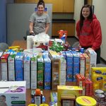 STUDENTS IN FAMILY HEALTH classes at Missouri State University-West Plains last fall used couponing strategies to purchase these items for three area agencies that provide services to individuals and families in need. With the items are Taya White, left, of Salem, Missouri, and Alex Harris, West Plains. (Photo provided)