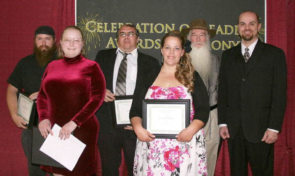 SEVERAL STUDENTS received awards in this year’s creative writing contest sponsored by the Missouri State University-West Plains Department of English and Writing Center, and they were recognized during the annual Celebration of Leaders student awards ceremony April 19 at the West Plains Civic Center theater. Front row from left, Sonrisa Quagliato, Mtn. View, second place fiction; and Courtney Kirkland, West Plains, first place essay. Second row: Lemuel Emunah, Dora, first and second place poetry, third place fiction, and third place essay; Oscar Navarrete, West Plains, first place fiction; Zerubbabel Emunah, Dora, third place poetry; and Assistant Professor of English Anthony Priest, who presented the awards. Jessica Smoot, Willow Springs, placed second in the essay category. (Missouri State-West Plains photo)