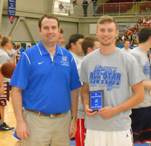 JACOB SMITH, right, Winona, won the slam dunk contest at the annual Grizzly All-Star Classic Saturday, April 4, at the West Plains Civic Center. He receives his award from Missouri State University-West Plains Head Coach Yancey Walker. (Photo provided)