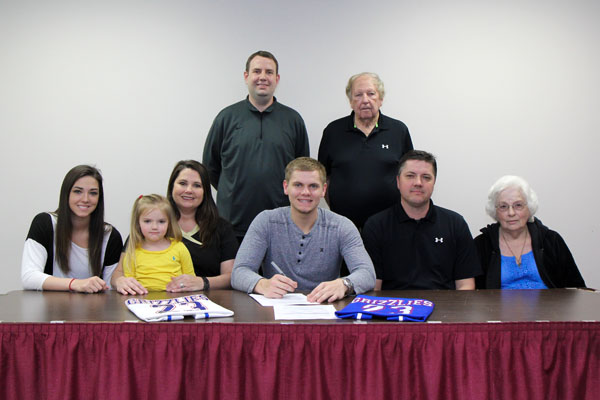 FRESHMAN GUARD KEETON TENNISON of the Missouri State University-West Plains Grizzly Basketball team recently signed paperwork to transfer to Southern Arkansas University in Magnolia and complete his collegiate career with the Muleriders. On hand for the signing were, seated from left, his sister, Payton; mother Shannon, who is holding sister, Bryton; Tennison; father David; and grandmother Jo Anne Jones. Standing: Grizzly Basketball Head Coach Yancey Walker and Tennison’s grandfather, Darryl Jones. (Missouri State-West Plains Photo)