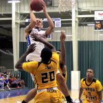 GRIZZLY POINT GUARD RICKY TORRES goes up in traffic as he drives to the basket during Saturday’s annual homecoming game against Three Rivers College. Torres led the team in scoring with 16 points. (Missouri State-West Plains Photo)
