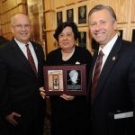 CAROL SILVEY, a former history professor and the first director of development at Missouri State University-West Plains, was one of five former Missouri State University faculty and staff inducted into the university’s Wall of Fame during a special ceremony Friday afternoon, Oct. 26, at the Plaster Student Union on the Springfield campus. During Silvey’s nearly 38-year tenure with the university, she taught students the importance of their roots, advised students as they collected over 1,000 hours of oral histories, grew the campus’ endowment to more than $1 million, established the campus’ development board and advisory board, and won numerous awards, including the Business and Professional Women’s Woman of the Year Award, the West Plains Chamber of Commerce’s Volunteer of the Year and Lifetime Achievement Awards, Outstanding Rotarian for Community Service Award, Mountain Grove Chamber of Commerce’s Lifetime Achievement Award, and the university’s Staff Community Service Award. Silvey is the first Missouri State-West Plains employee selected for the Wall of Fame. With Silvey above are Missouri State University System President Clif Smart, left, and Missouri State-West Plains Chancellor Drew Bennett. (Missouri State University Photo)