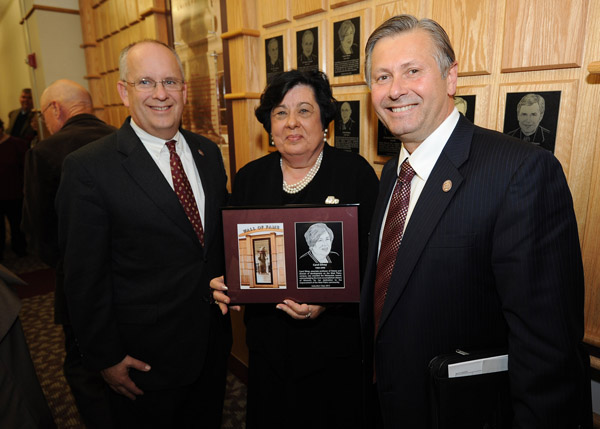 CAROL SILVEY, a former history professor and the first director of development at Missouri State University-West Plains, was one of five former Missouri State University faculty and staff inducted into the university’s Wall of Fame during a special ceremony Friday afternoon, Oct. 26, at the Plaster Student Union on the Springfield campus. During Silvey’s nearly 38-year tenure with the university, she taught students the importance of their roots, advised students as they collected over 1,000 hours of oral histories, grew the campus’ endowment to more than $1 million, established the campus’ development board and advisory board, and won numerous awards, including the Business and Professional Women’s Woman of the Year Award, the West Plains Chamber of Commerce’s Volunteer of the Year and Lifetime Achievement Awards, Outstanding Rotarian for Community Service Award, Mountain Grove Chamber of Commerce’s Lifetime Achievement Award, and the university’s Staff Community Service Award. Silvey is the first Missouri State-West Plains employee selected for the Wall of Fame. With Silvey above are Missouri State University System President Clif Smart, left, and Missouri State-West Plains Chancellor Drew Bennett. (Missouri State University Photo)