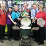 BETTER THAN AN EASTER EGG is this Big Green Egg charcoal grill donated by Westlake Ace Hardware 101, 1401 Mitchell Rd., to Missouri State University-West Plains’ annual auction, set for April 11 at the West Plains Opera House in downtown West Plains. The grill is one of many items that will be up for bid in the event’s 20th year. Proceeds will go toward two projects – the Tuttle Amphitheater and upgrades to the Garnett Library. Reserved tables of eight are on sale now for $350. Open theater-style seating also is available for $35 per person. Visit http://wp.missouristate.edu/development/auction.htm or call the development office at 417-255-7240 for more information or to purchase tickets. With the grill above are Westlake representative Wayne Gore, Development Events Coordinator Amanda Niemotka, auction committee member Connie Pfeifer, Westlake representative Kelly Sapanas, Director of Development Joe Kammerer, Administrative Assistant Debbie Martin and Taler Sutherland, a student at the university and auction committee member. (Missouri State-West Plains Photo)
